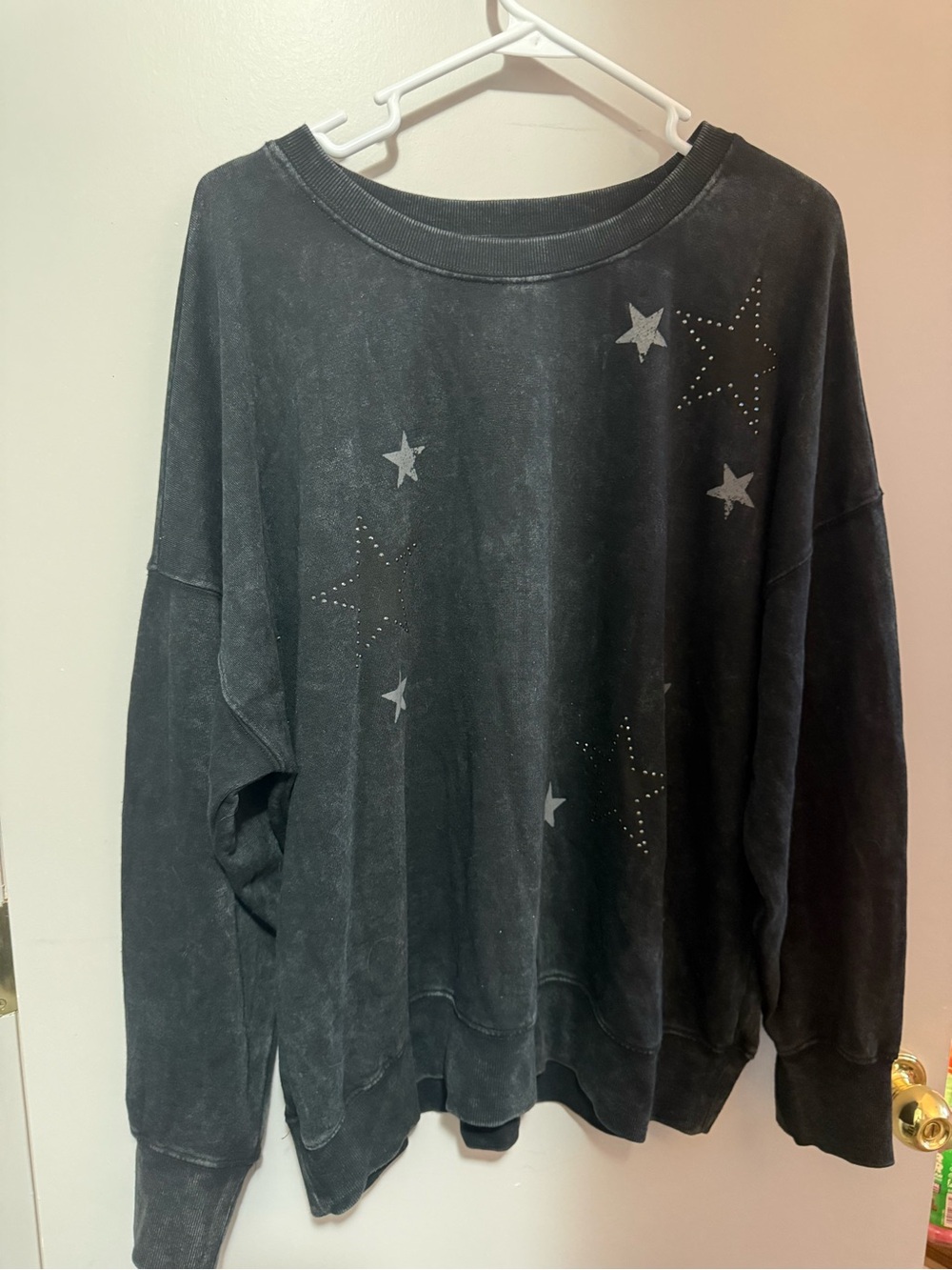 Maurices Black Crewneck Pullover with Rhinestone Star detail.